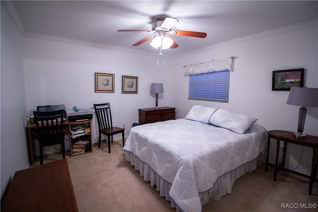 carpeted bedroom with ceiling fan and crown molding