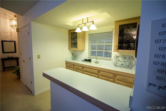 kitchen featuring sink and decorative light fixtures