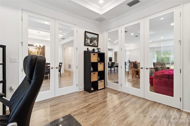 office area with a chandelier, french doors, light hardwood / wood-style floors, and crown molding