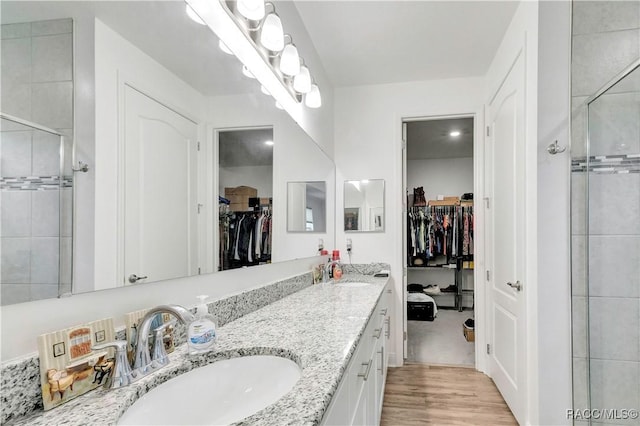 bathroom featuring vanity and hardwood / wood-style flooring