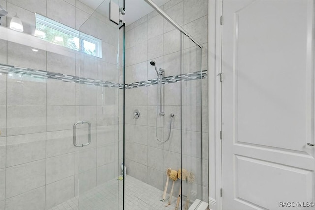 bathroom featuring an enclosed shower