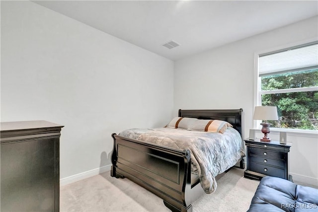 bedroom featuring light carpet