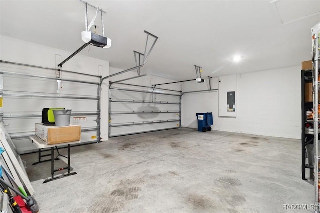 garage with electric panel and a garage door opener