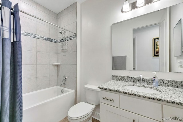 full bathroom featuring vanity, toilet, and shower / tub combo with curtain