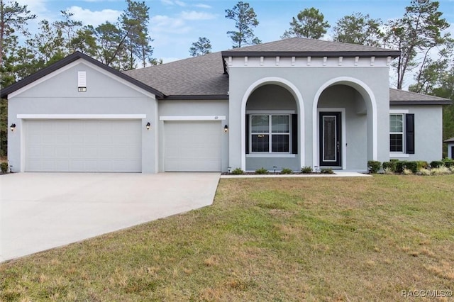 view of front facade with a garage and a front yard