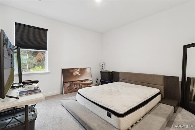 bedroom with light colored carpet