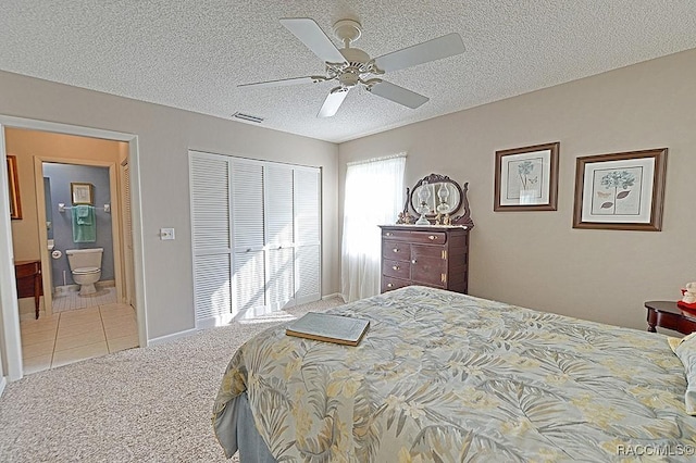 bedroom with light carpet, ensuite bathroom, a textured ceiling, ceiling fan, and a closet