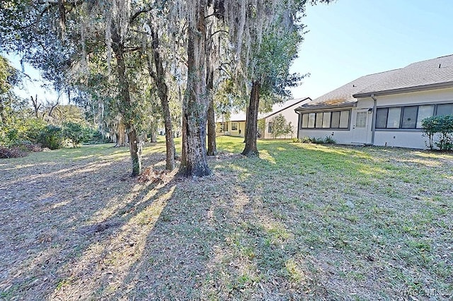 view of yard with a sunroom