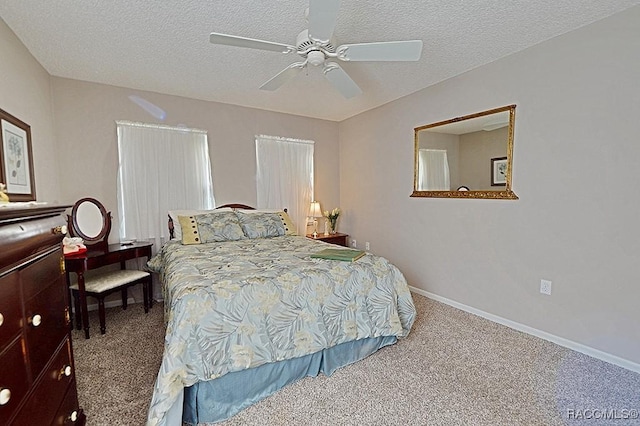 bedroom with carpet, ceiling fan, and a textured ceiling