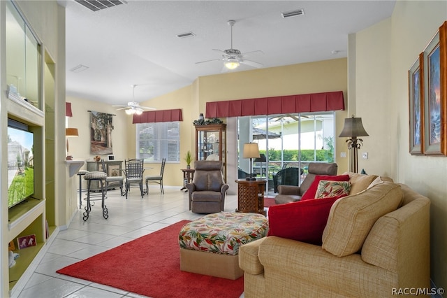 living room with ceiling fan, light tile patterned flooring, and a healthy amount of sunlight