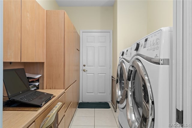 clothes washing area with light tile patterned floors and washing machine and clothes dryer