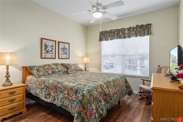 bedroom with ceiling fan and dark wood-type flooring