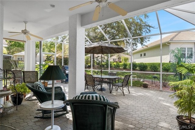 sunroom / solarium with ceiling fan and a healthy amount of sunlight