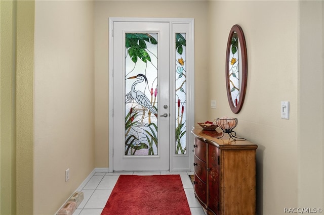 entryway with light tile patterned flooring