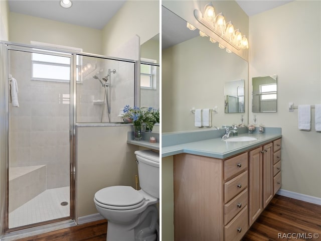 bathroom featuring hardwood / wood-style flooring, vanity, toilet, and walk in shower