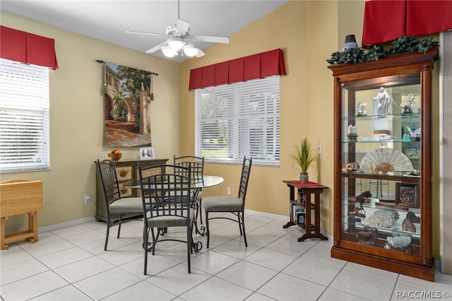 dining room with ceiling fan and light tile patterned flooring