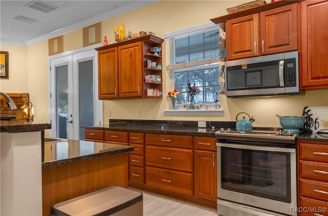 kitchen with sink, stainless steel appliances, dark stone countertops, light hardwood / wood-style floors, and ornamental molding