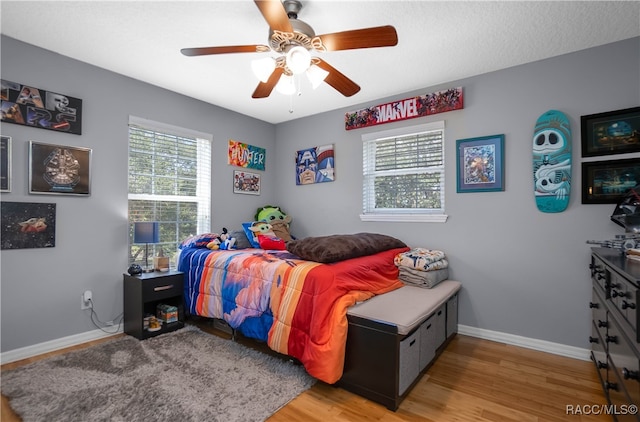 bedroom featuring ceiling fan and light wood-type flooring