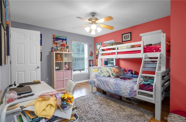 bedroom featuring ceiling fan and hardwood / wood-style floors