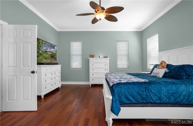 bedroom featuring ceiling fan, dark hardwood / wood-style flooring, and crown molding