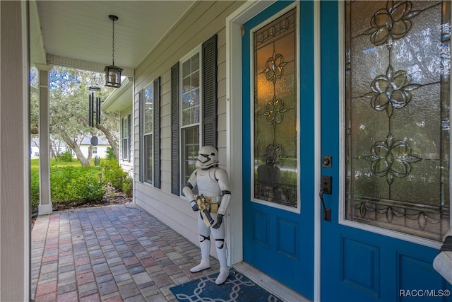 doorway to property with a porch