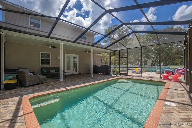 view of pool featuring a patio area, ceiling fan, french doors, and an outdoor hangout area