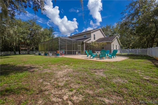 view of yard featuring a patio and a lanai