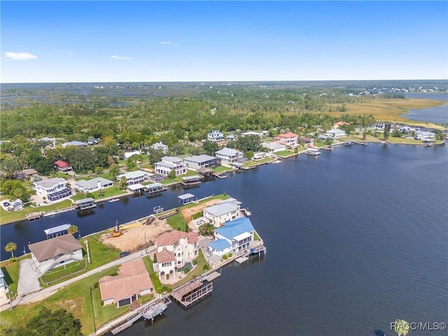 birds eye view of property featuring a water view and a residential view