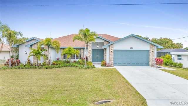 single story home with a front yard and a garage