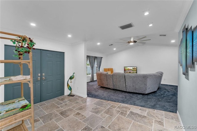 living room with ceiling fan, ornamental molding, and lofted ceiling