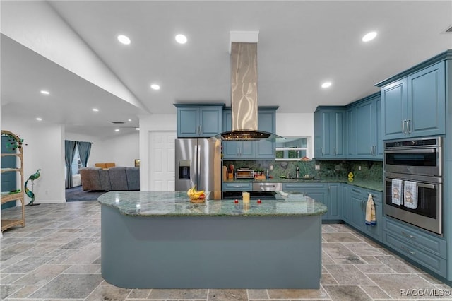 kitchen with a center island, stainless steel appliances, decorative backsplash, vaulted ceiling, and stone counters