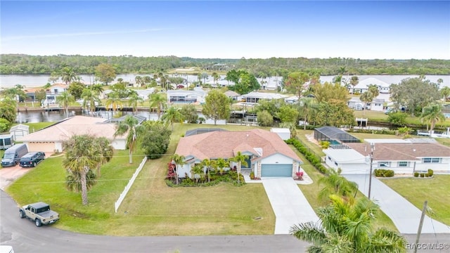 birds eye view of property with a water view