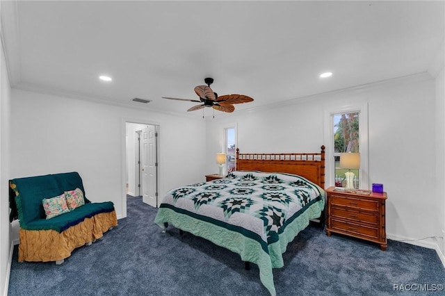 carpeted bedroom featuring ceiling fan and crown molding