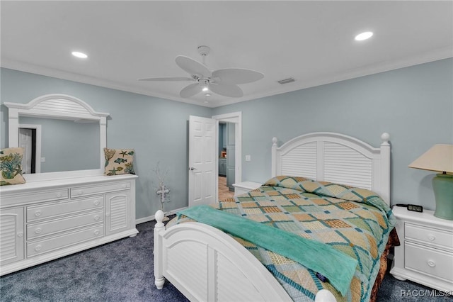 carpeted bedroom featuring ceiling fan and ornamental molding