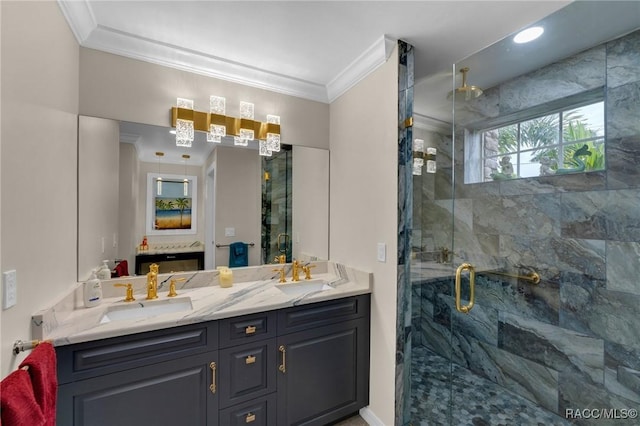 bathroom with vanity, a shower with door, and ornamental molding