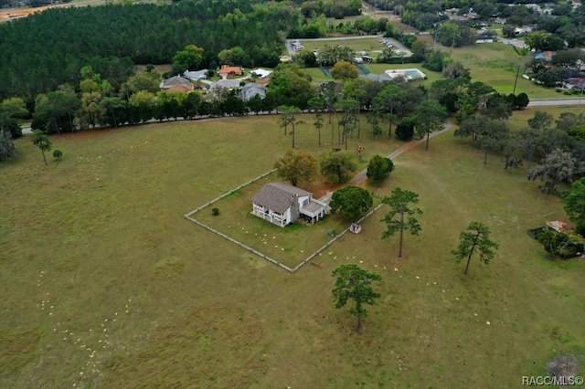 birds eye view of property with a rural view