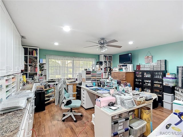 home office with recessed lighting, light wood-type flooring, and a ceiling fan