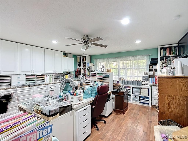 office with recessed lighting, a ceiling fan, light wood-style floors, and a textured ceiling