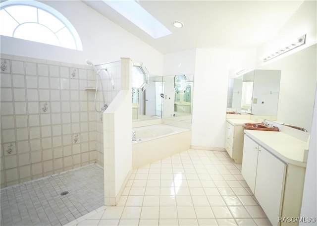 full bathroom with lofted ceiling with skylight, tile patterned floors, a garden tub, and a walk in shower
