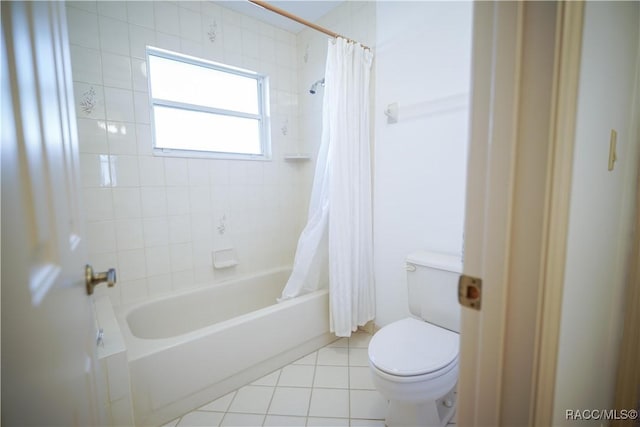 bathroom with shower / bath combo, toilet, and tile patterned floors