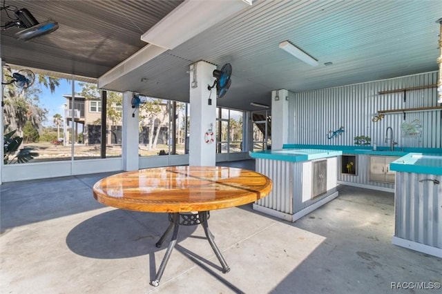 view of patio / terrace featuring ceiling fan