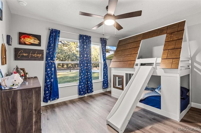 bedroom featuring ceiling fan and light hardwood / wood-style flooring