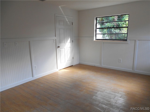 spare room featuring light hardwood / wood-style floors