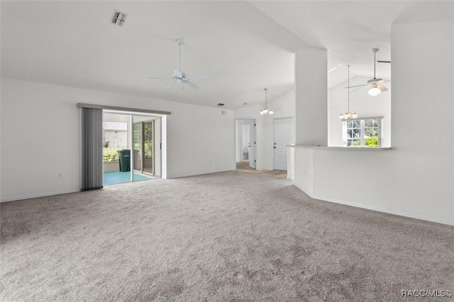 2739 N Brentwood Cir, Lecanto, FL 34461 - unfurnished living room with ceiling fan, carpet floors, a chandelier, baseboards, and high vaulted ceiling