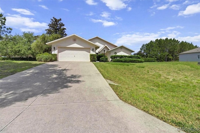 2739 N Brentwood Cir, Lecanto, FL 34461 - single story home with driveway, a front lawn, an attached garage, and stucco siding