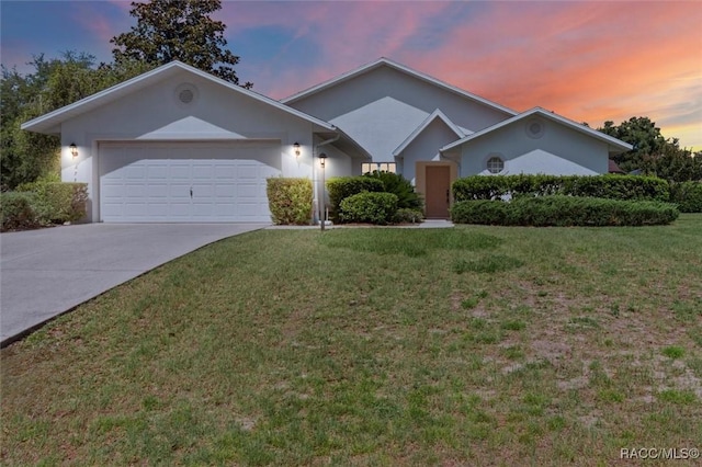 2739 N Brentwood Cir, Lecanto, FL 34461 - single story home featuring concrete driveway, a garage, a lawn, and stucco siding