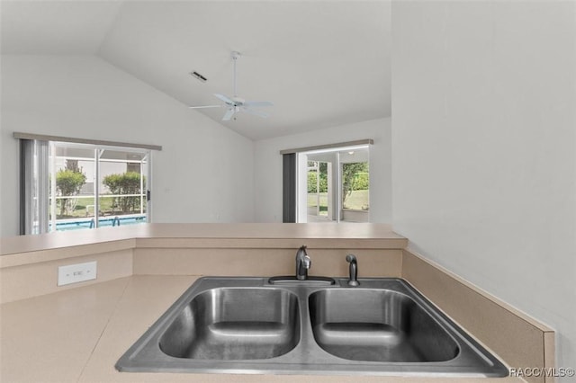 2739 N Brentwood Cir, Lecanto, FL 34461 - kitchen featuring a sink, lofted ceiling, a ceiling fan, and light countertops