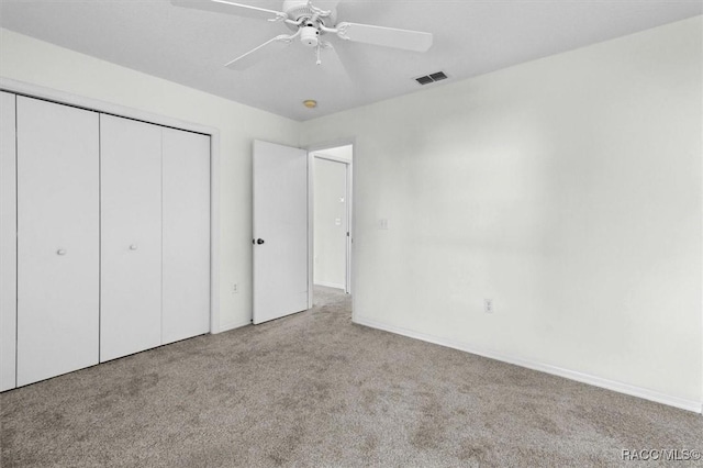 2739 N Brentwood Cir, Lecanto, FL 34461 - unfurnished bedroom featuring carpet flooring, a closet, ceiling fan, and baseboards