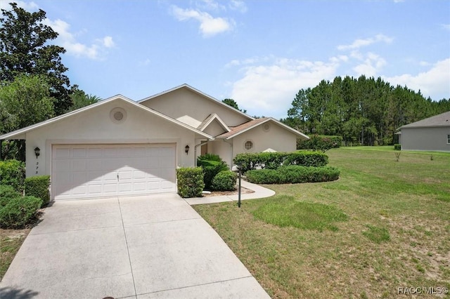 2739 N Brentwood Cir, Lecanto, FL 34461 - single story home featuring a garage, concrete driveway, a front lawn, and stucco siding