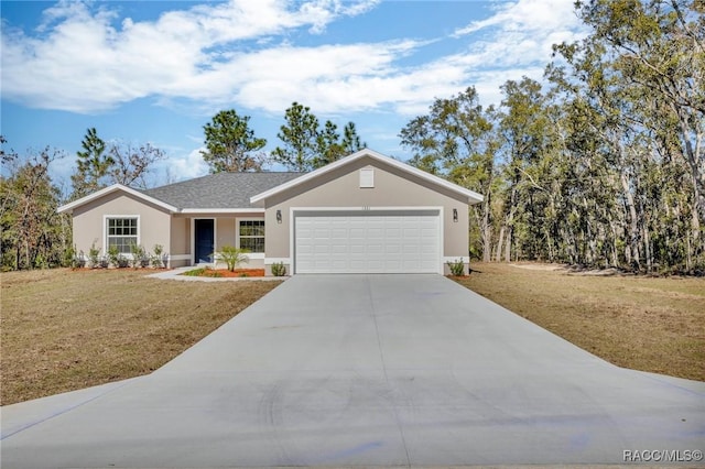 ranch-style home featuring a front lawn and a garage